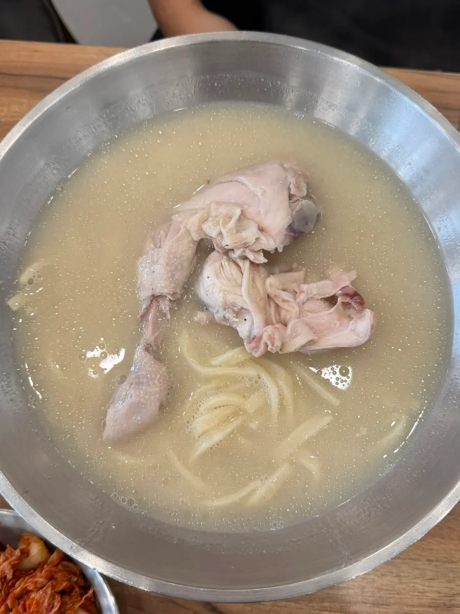 Perilla chicken kalguksu with half a chicken inside
