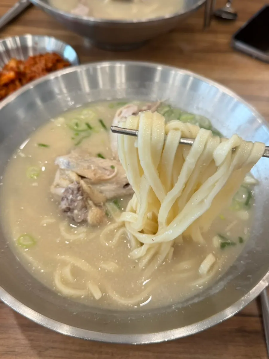 Rice mixed into the thick chicken broth