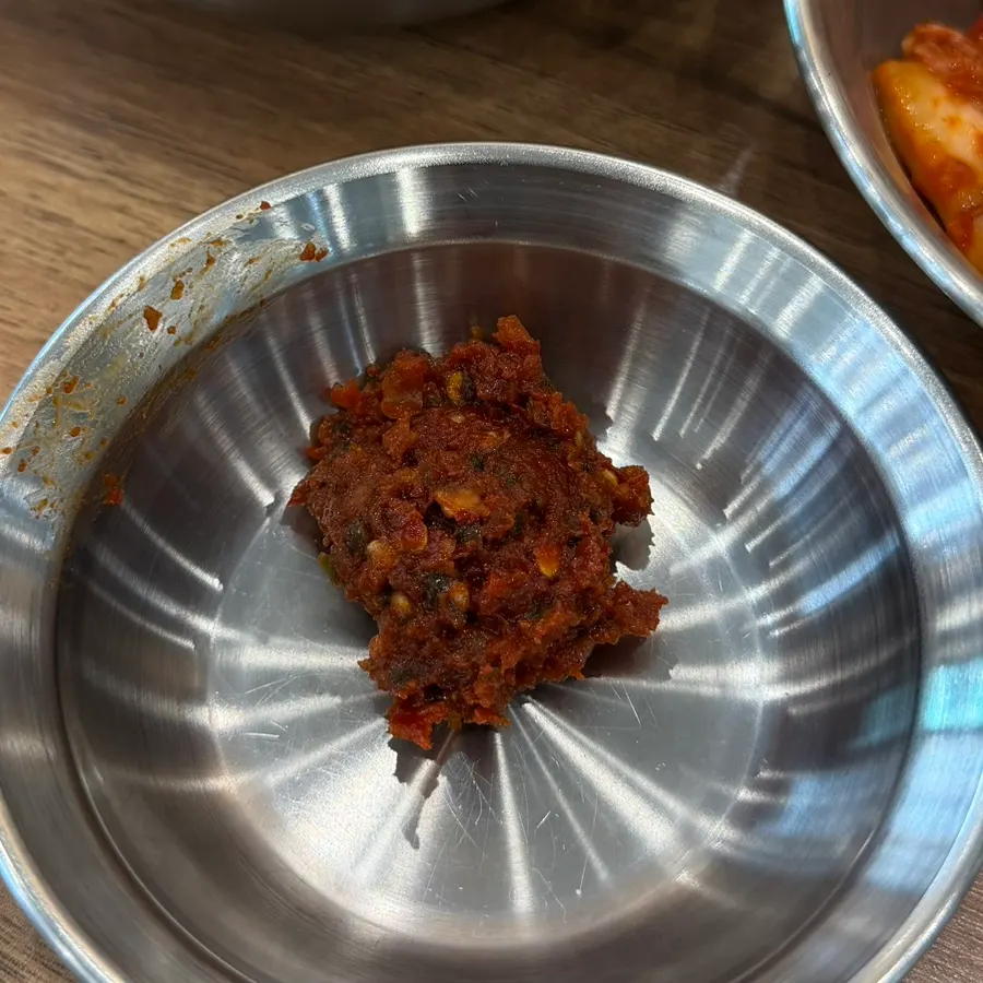 Dak kalguksu paired with spicy kimchi