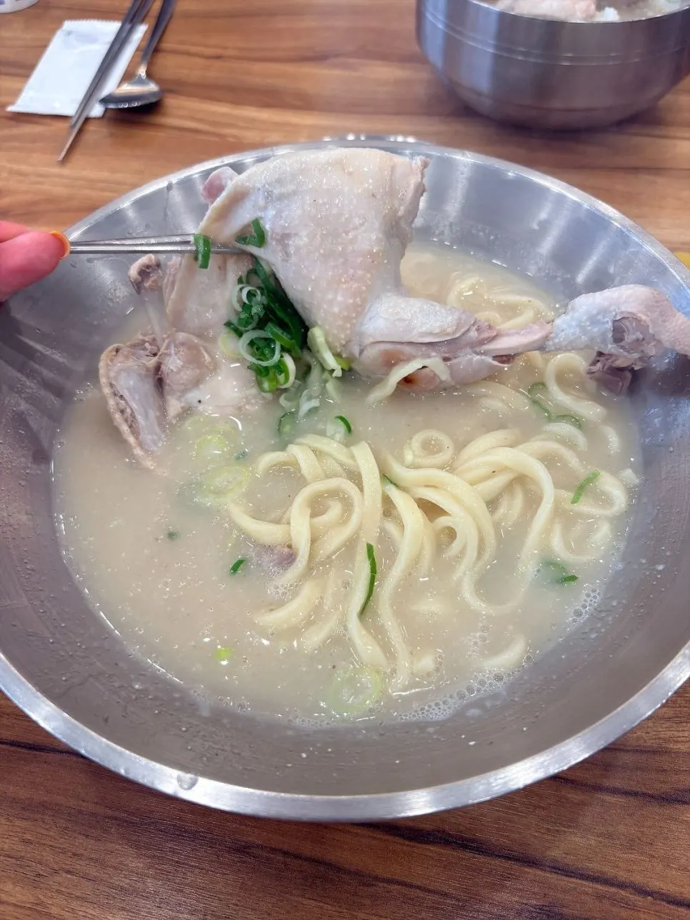 Chicken meat from the kalguksu falling apart tenderly