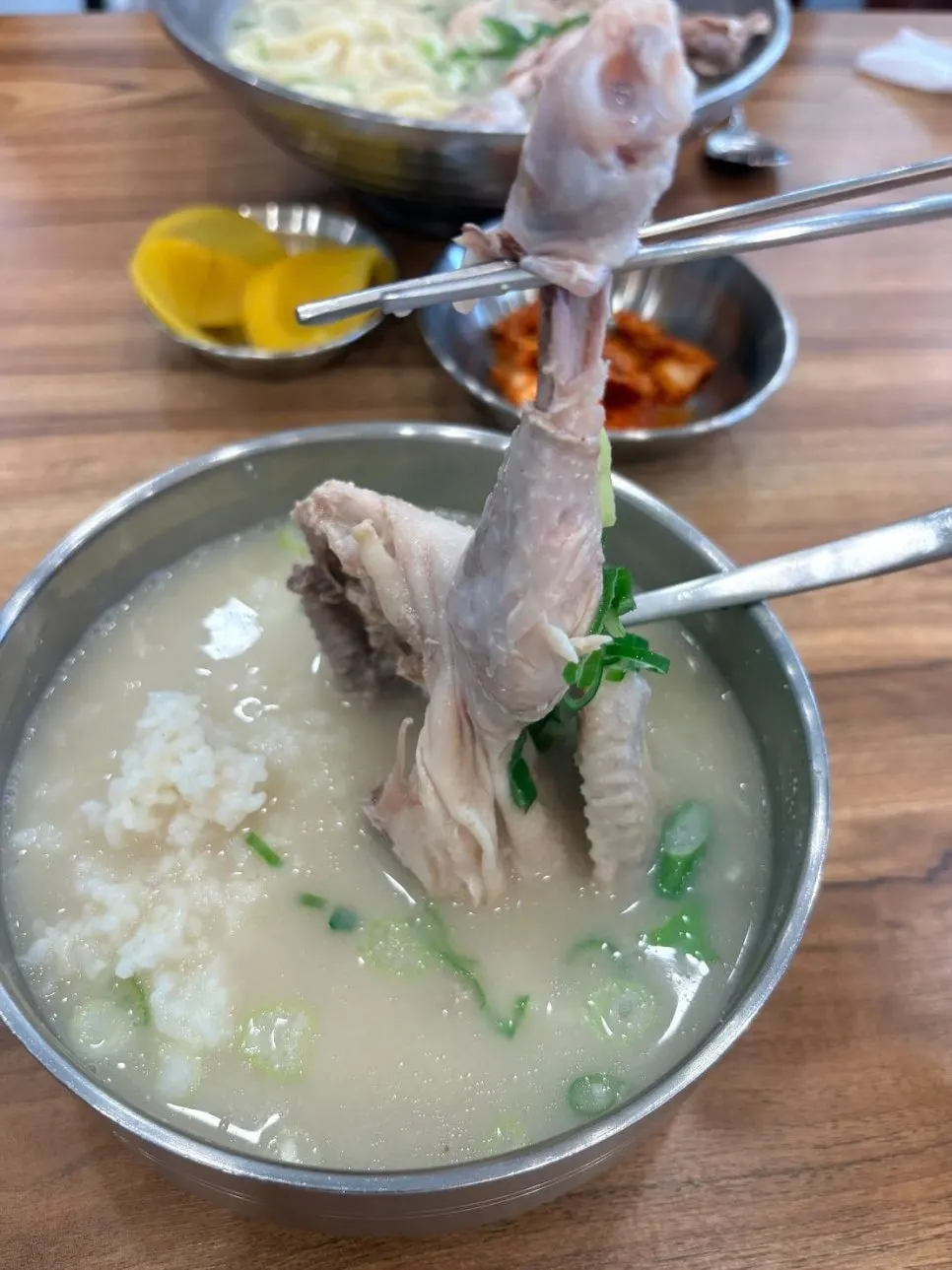 A hearty chicken leg piece in the chicken gomtang
