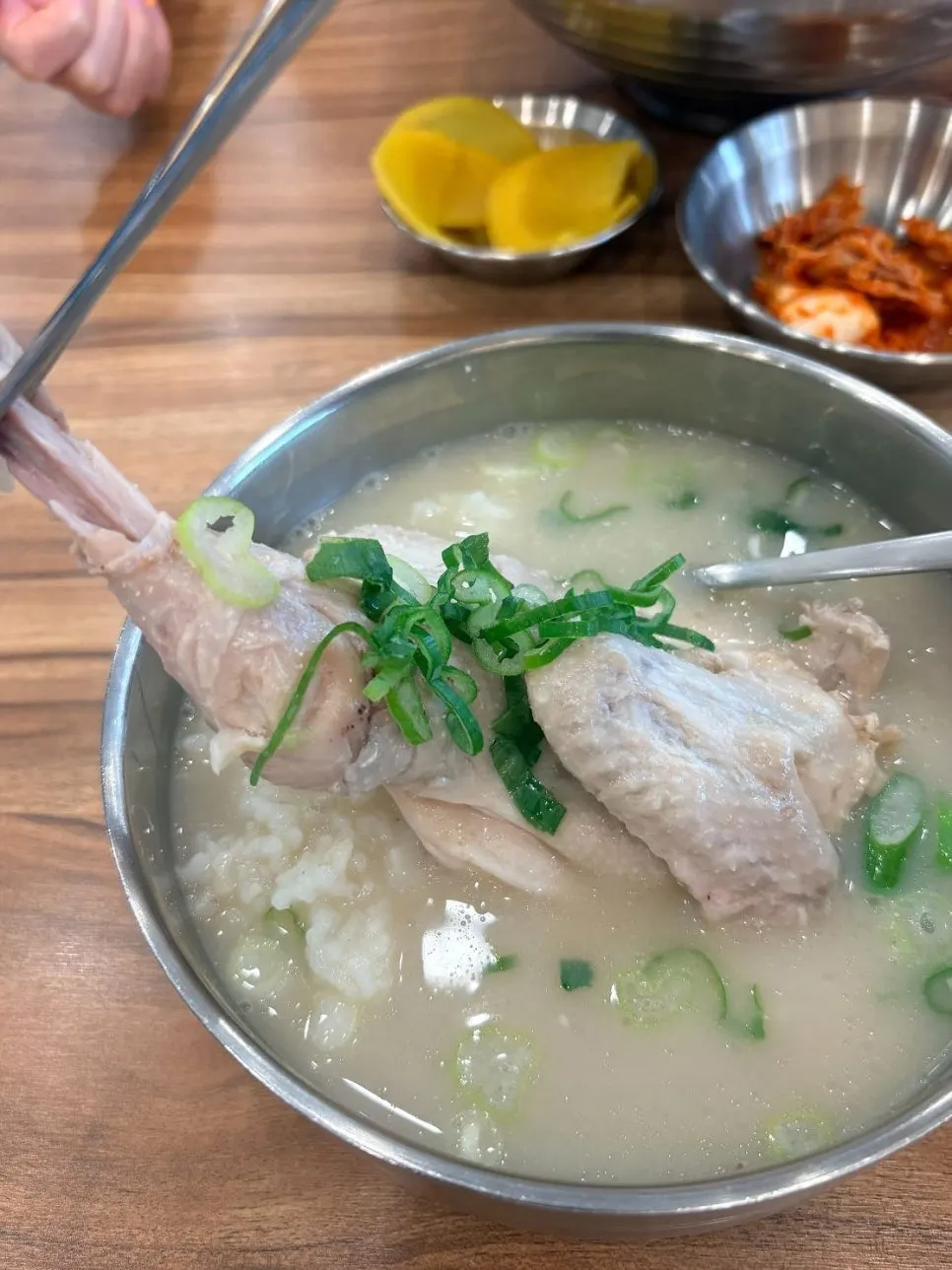 A nearly emptied bowl of chicken gomtang