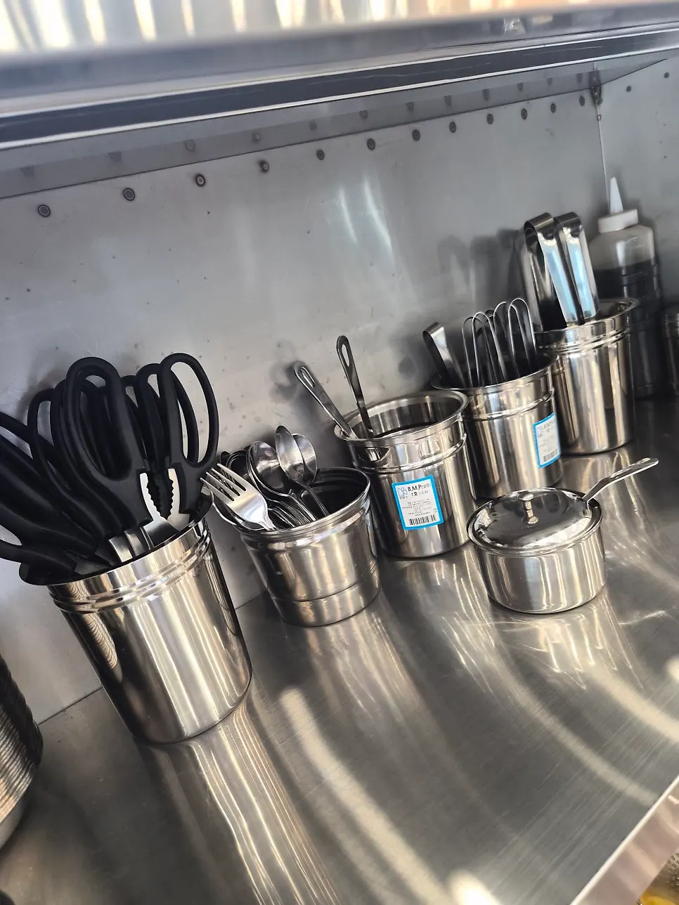 Self-service station stocked with tableware