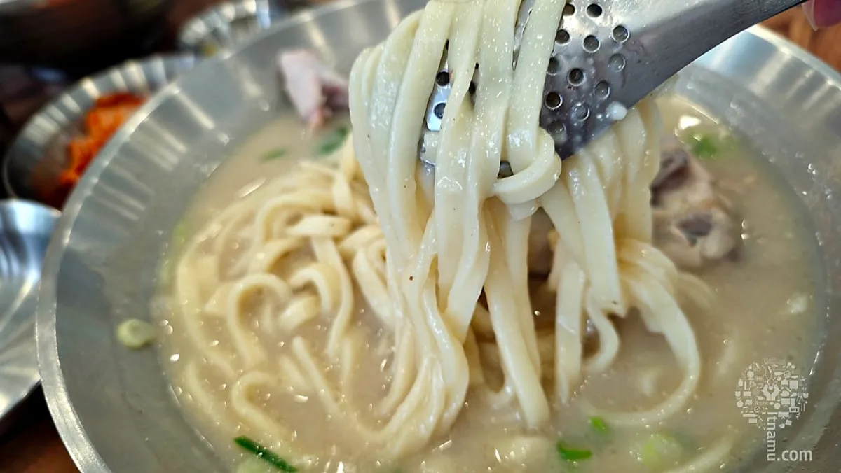 Chicken kalguksu with half a chicken
