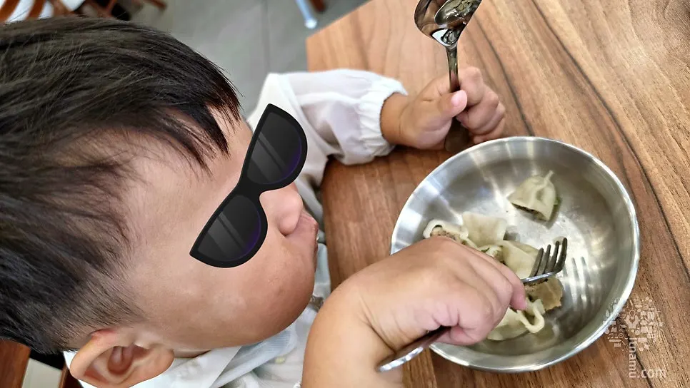 Children eating chewy dumplings