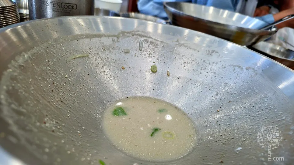 Thick chicken kalguksu broth with perilla seeds