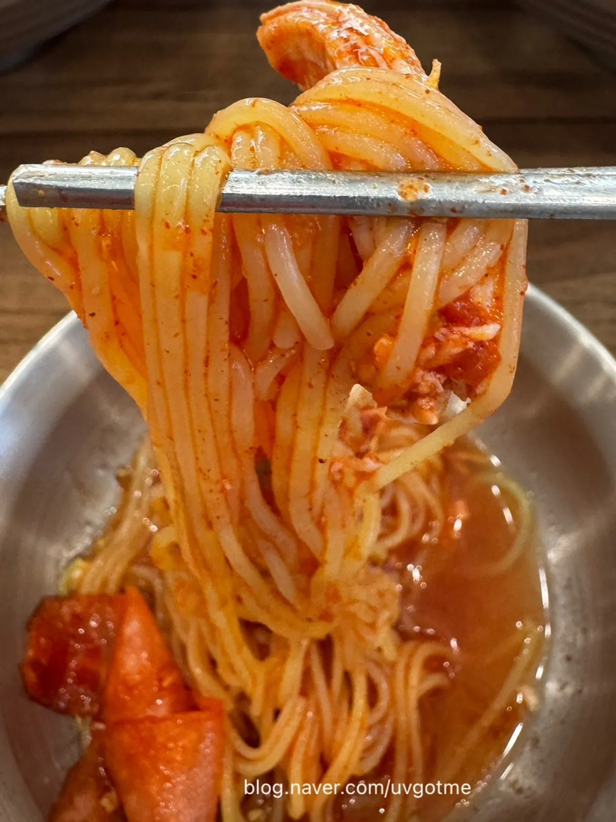 Chogye guksu noodles lifted with chopsticks