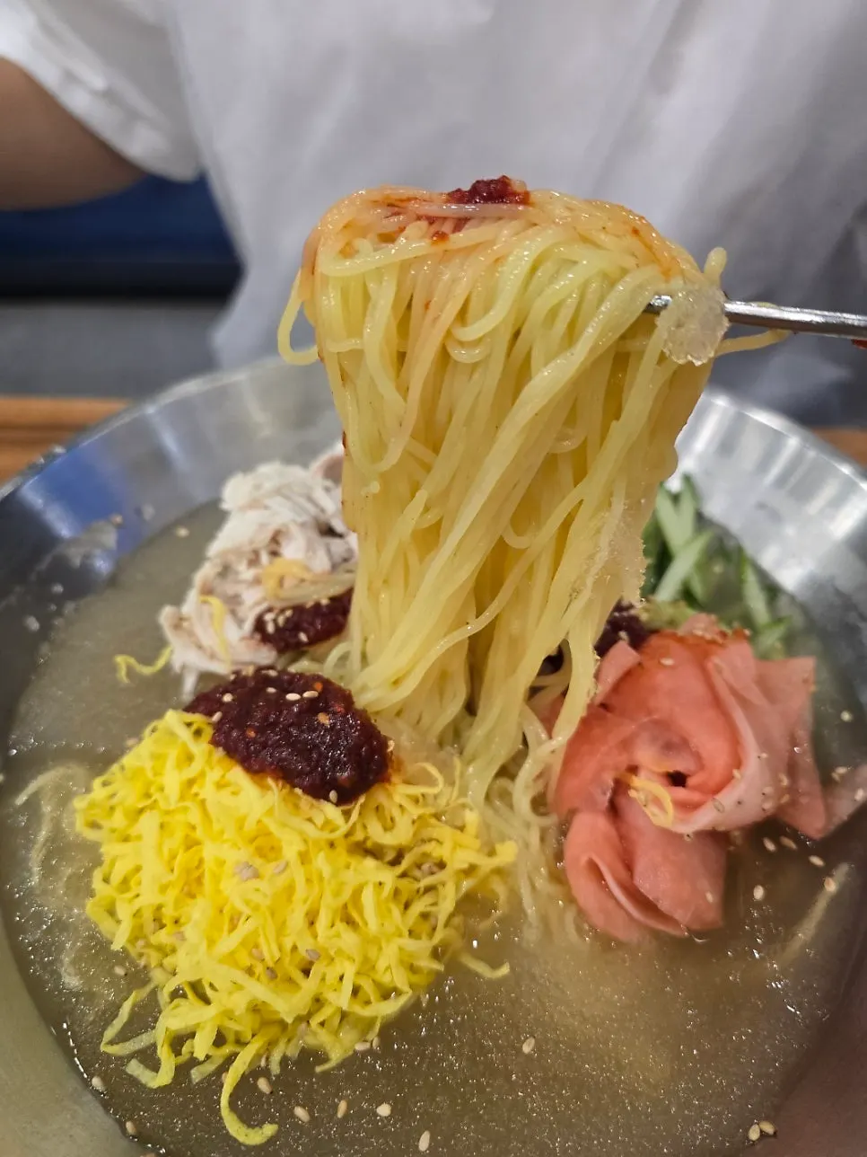 Warm chicken kalguksu broth