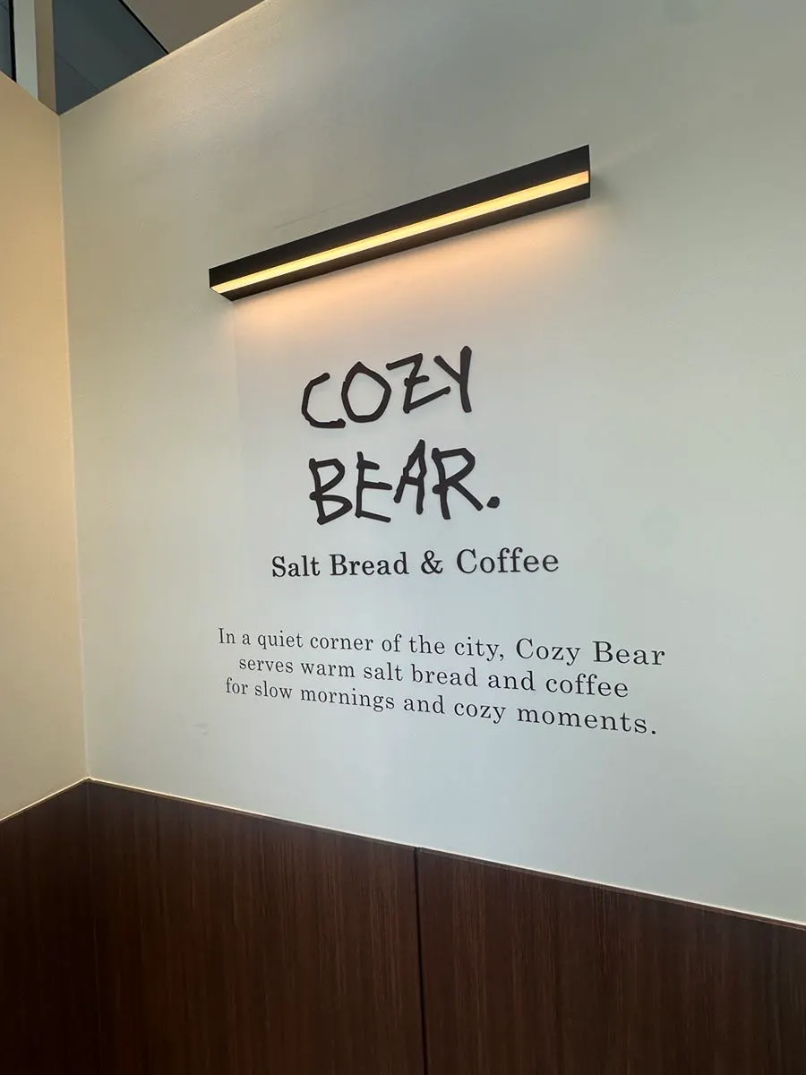 Cafe Cozy Bear entrance seen from across the public parking lot