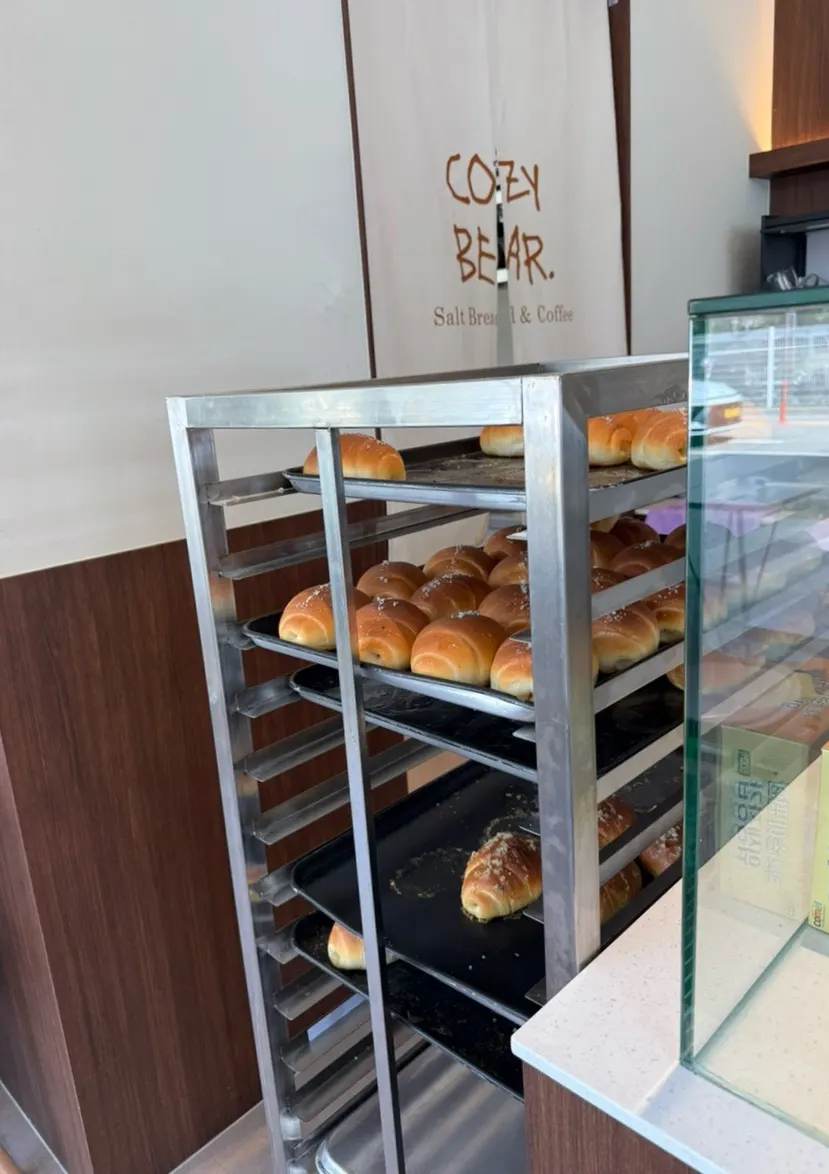 Sign showing Cozy Bear's twice-daily salt bread bake schedule