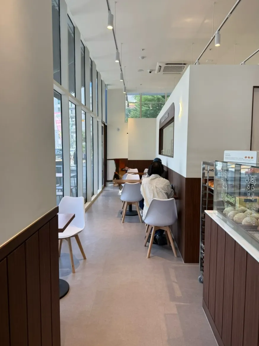 Cozy Bear's seating stretching along the window wall