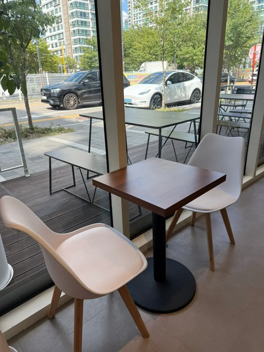 Two-person table facing the window