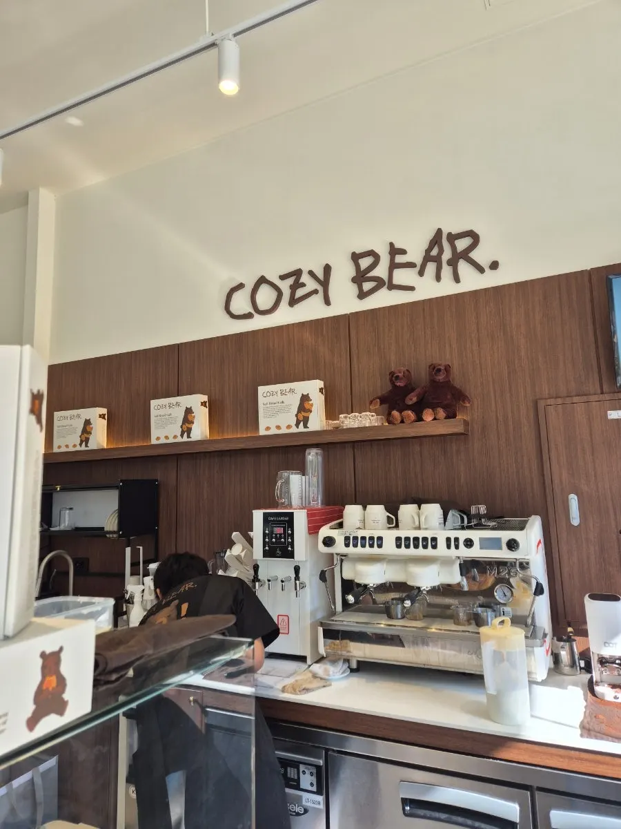Exterior of Cozy Bear café with a bear drawing