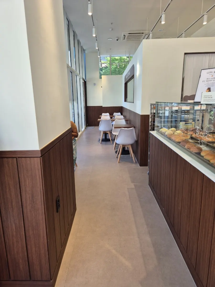 Café interior with a bear character
