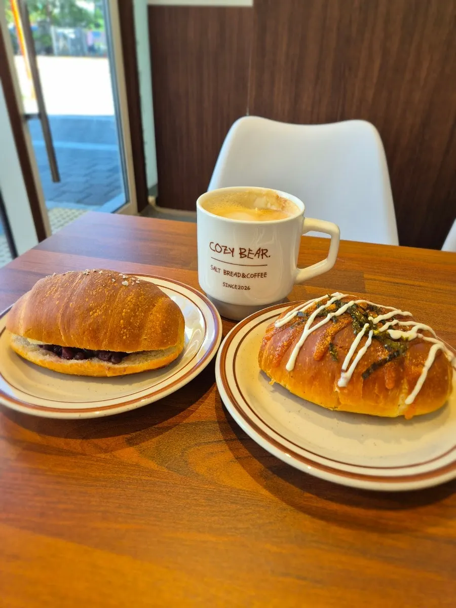 Salt bread served on tableware beside a mug