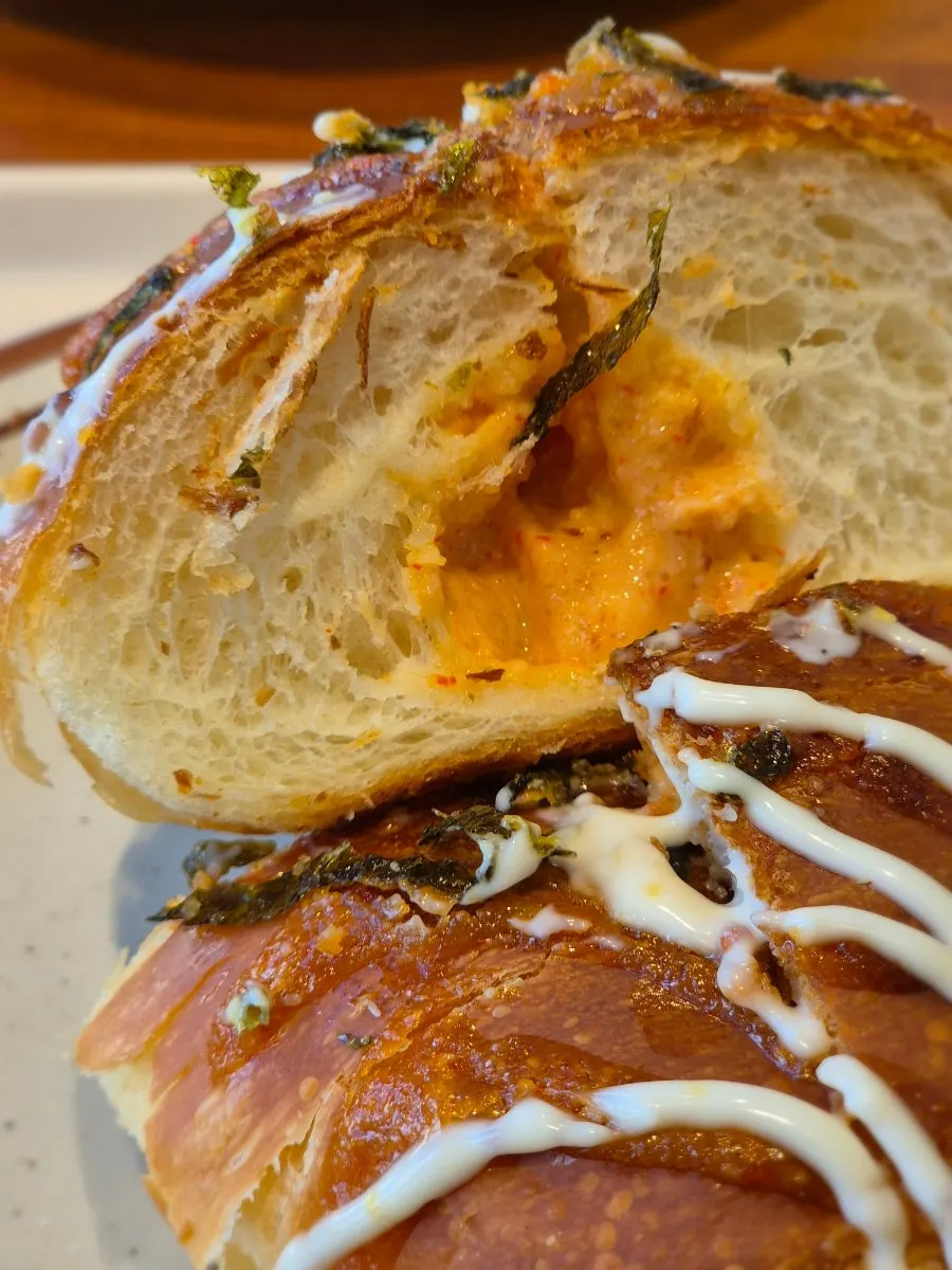 Pollock roe salt bread garnished with seaweed flakes
