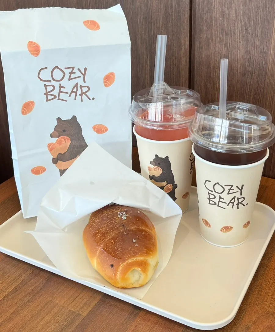Iced americano and grapefruit ade in bear-themed packaging