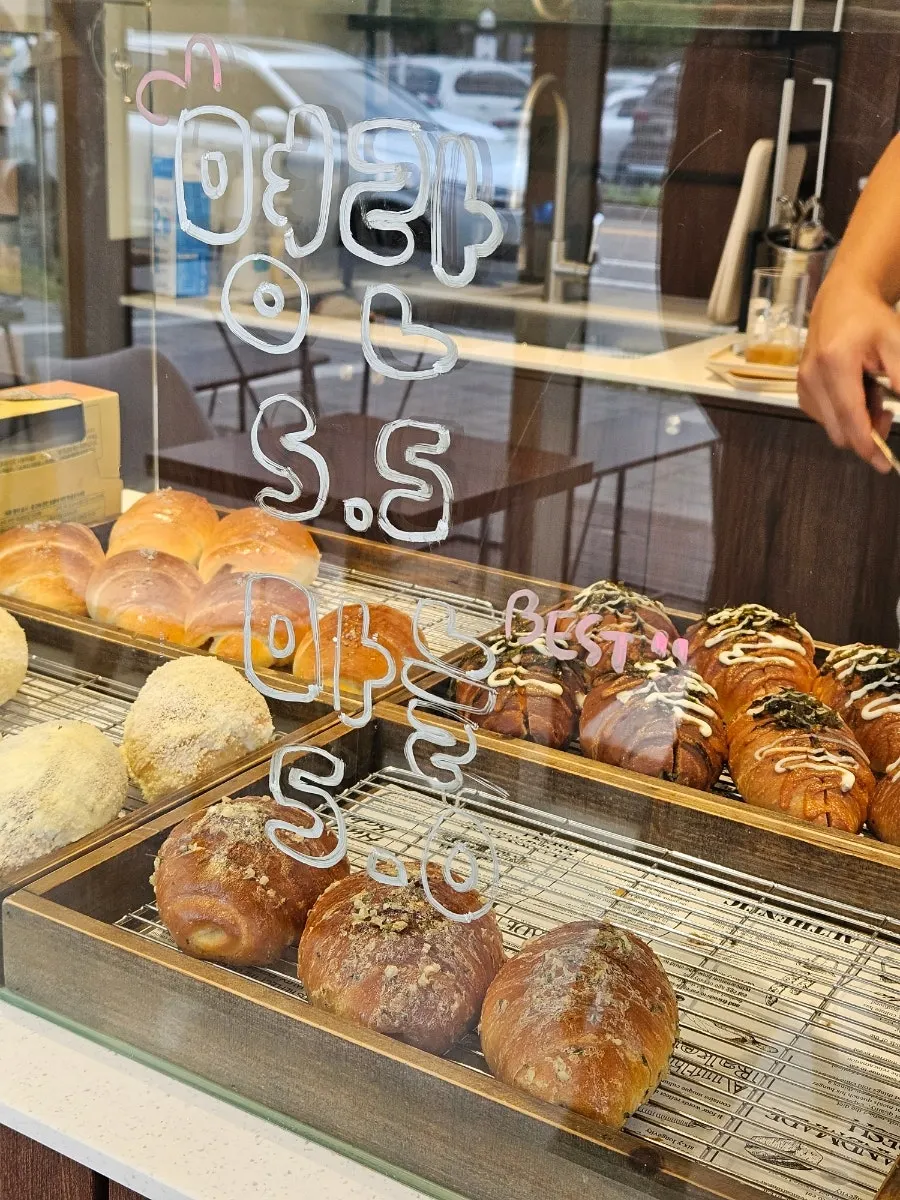 Counter stacked with freshly baked salt bread