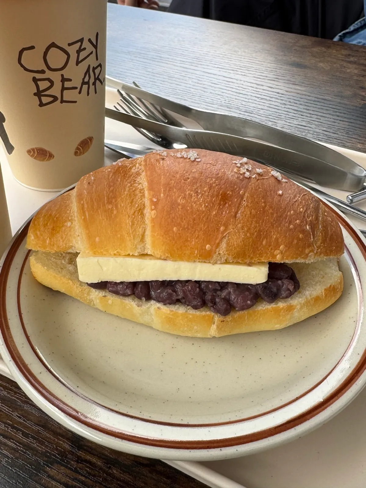 Salt bread and iced Americano set on the terrace table