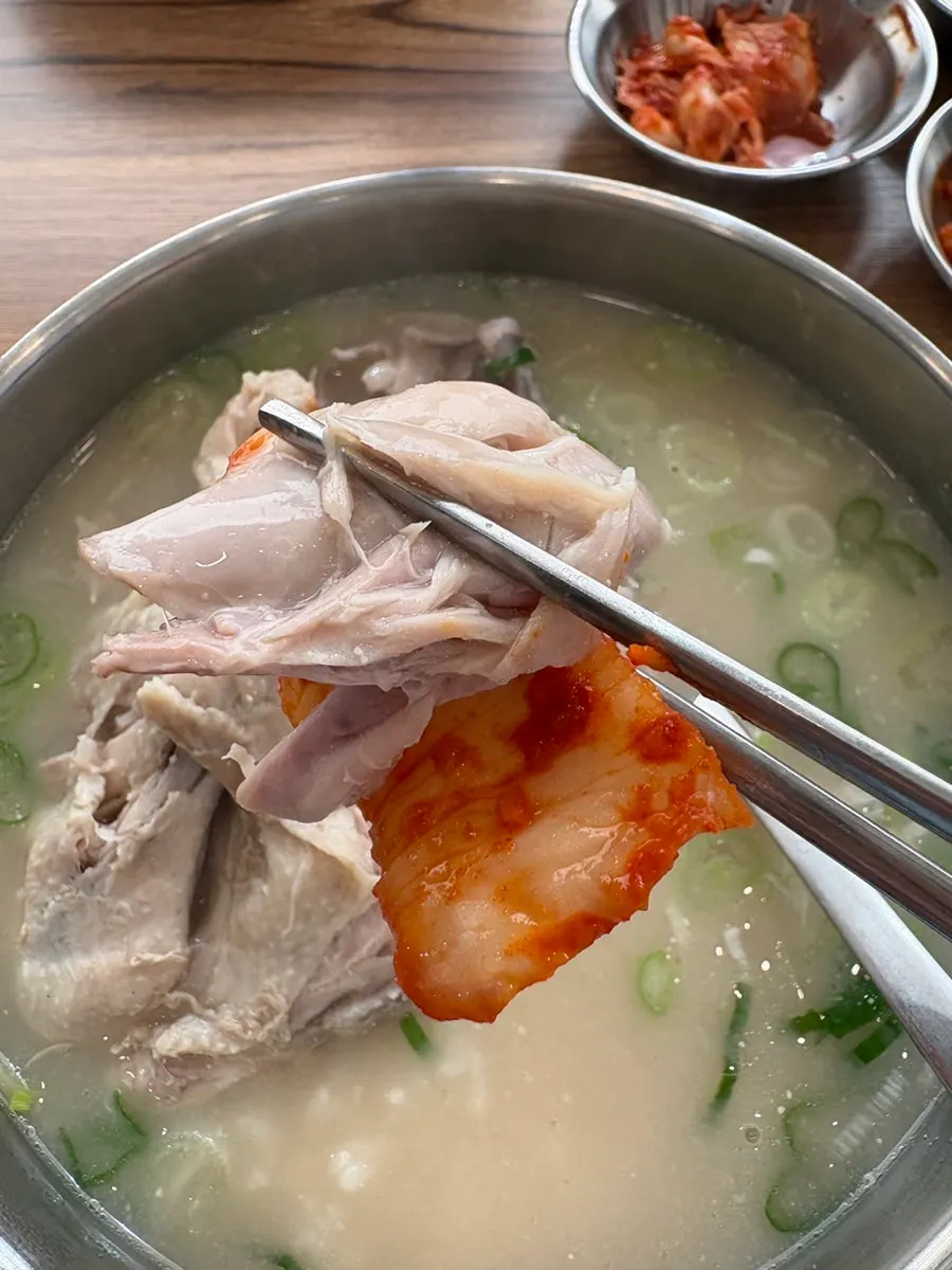 Full spread of chicken gomtang eaten with rice