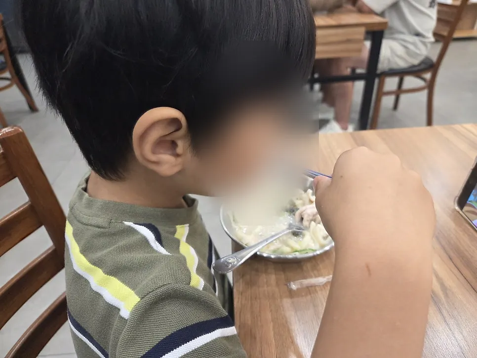 Noodles scooped into a child's bowl