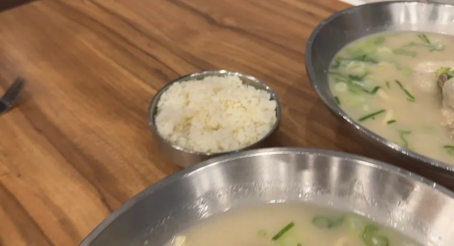 Chicken kalguksu with a bowl of rice