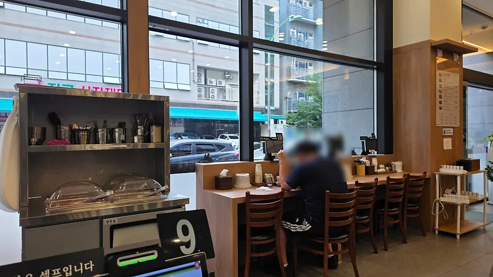 Corner of the restaurant set up with solo dining seats