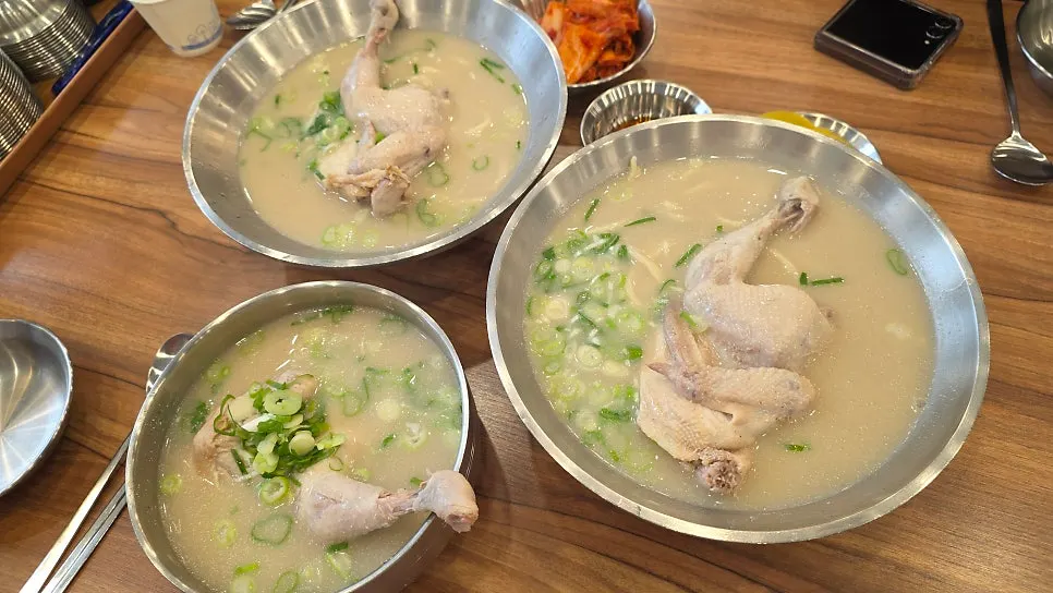 Full spread of large dak kalguksu, dak gomtang, and chewy dumplings
