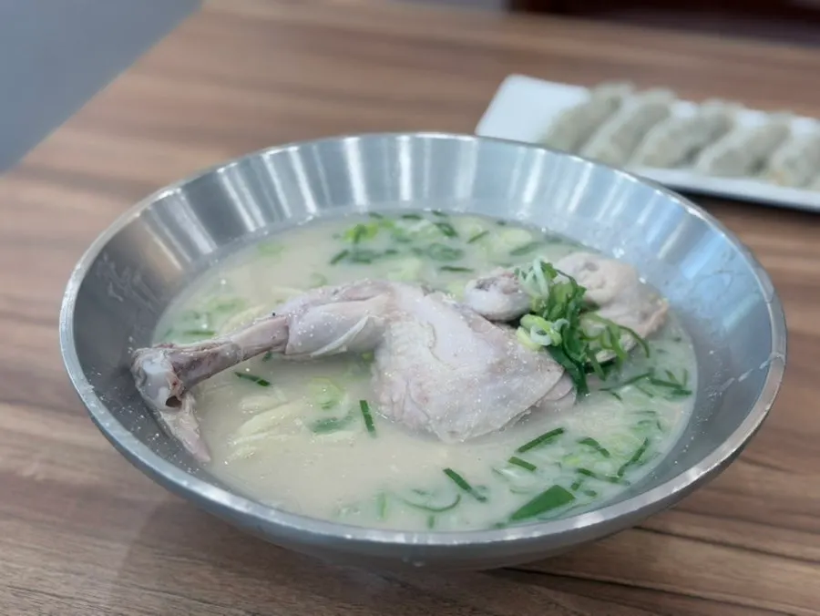 Ordered dak kalguksu and chewy mandu dumplings on the table