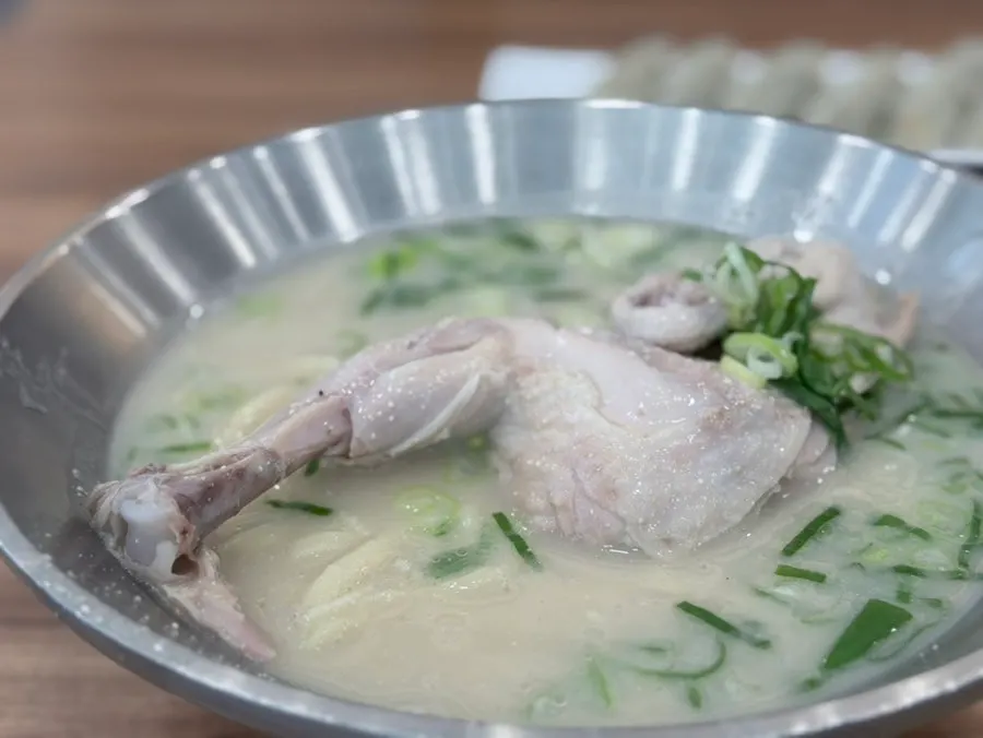 Dak kalguksu topped with half a whole chicken