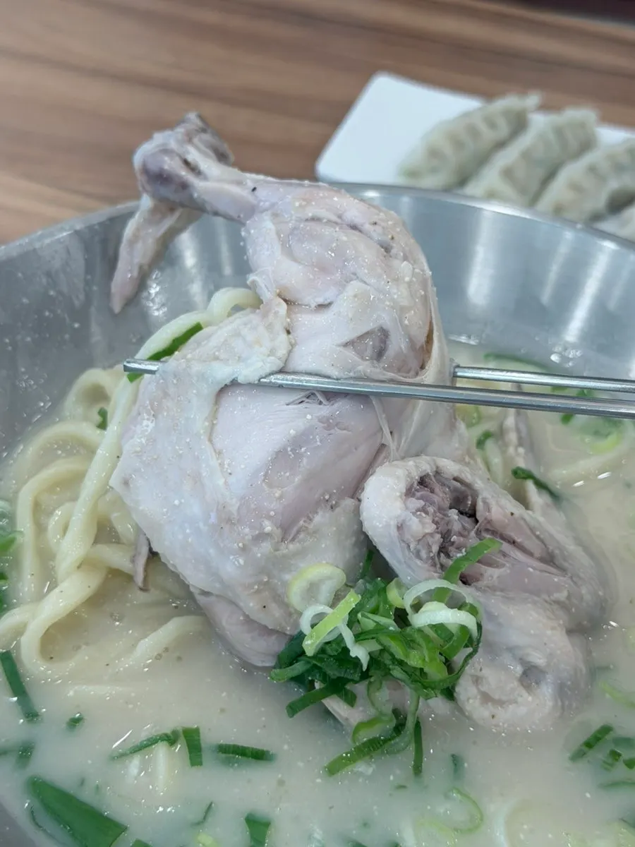 A spoonful of dak kalguksu broth
