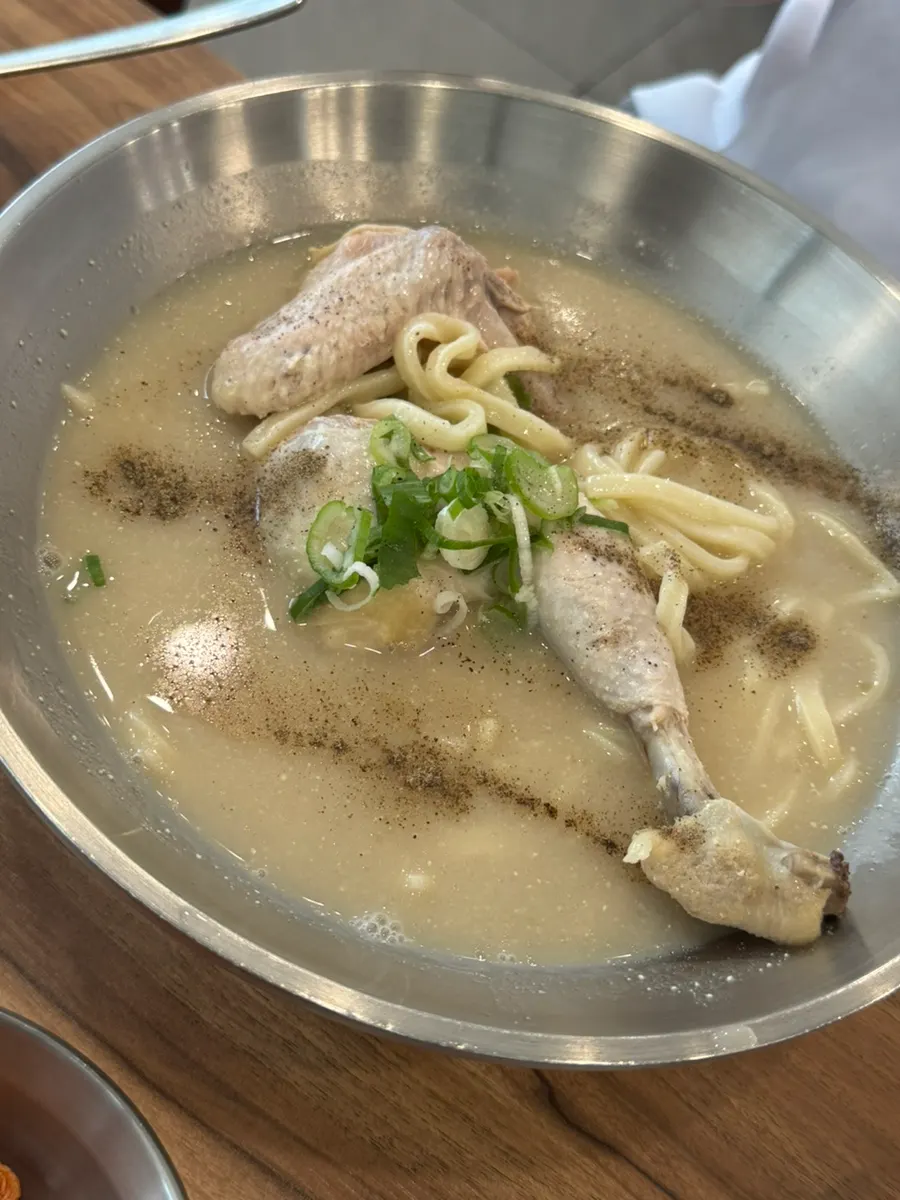 Chicken kalguksu eaten with pepper and kimchi