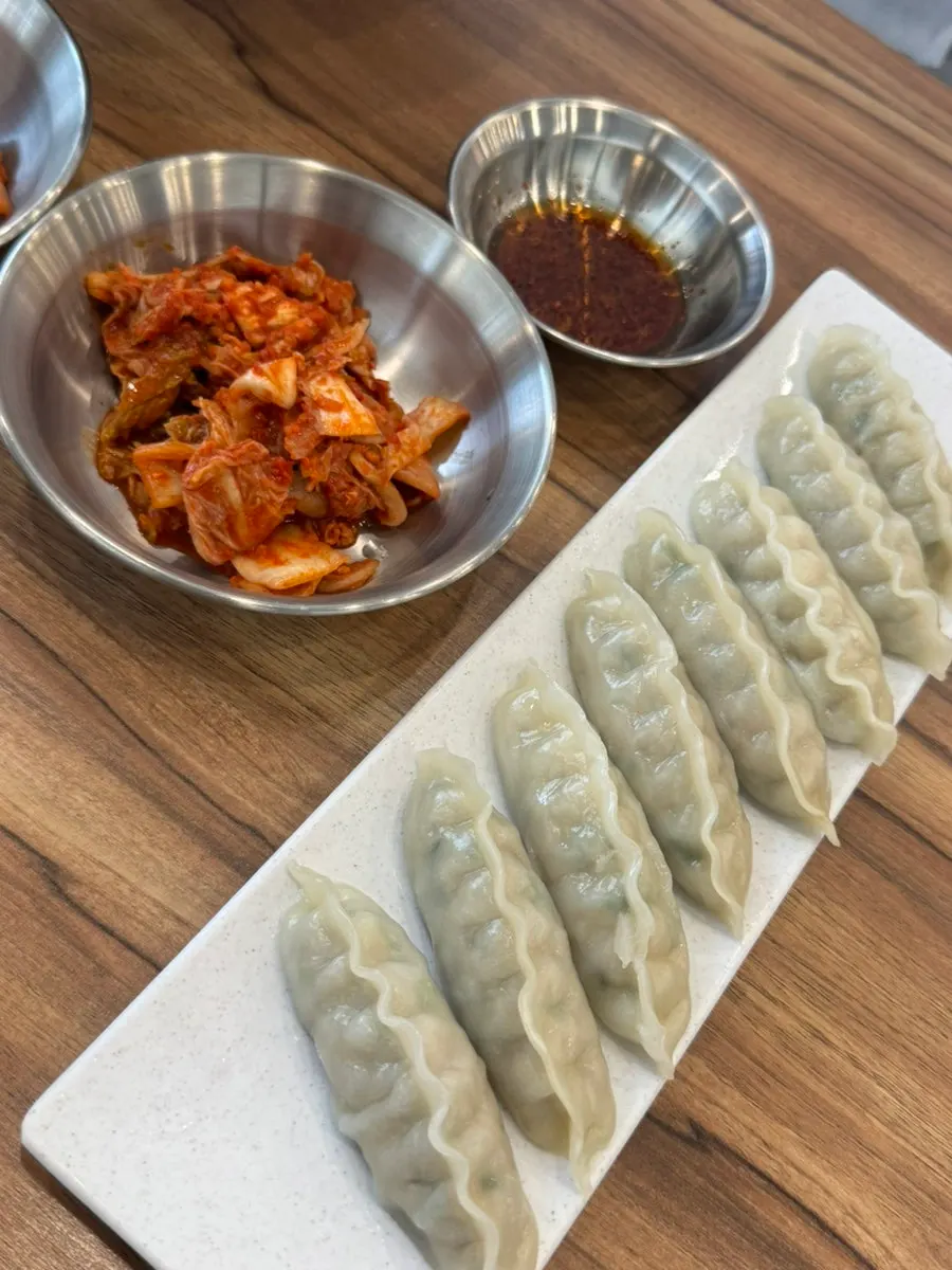 A plate of chewy dumplings ordered as a side