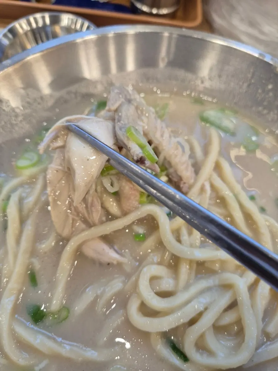 Eonyang dak kalguksu with perilla chicken broth