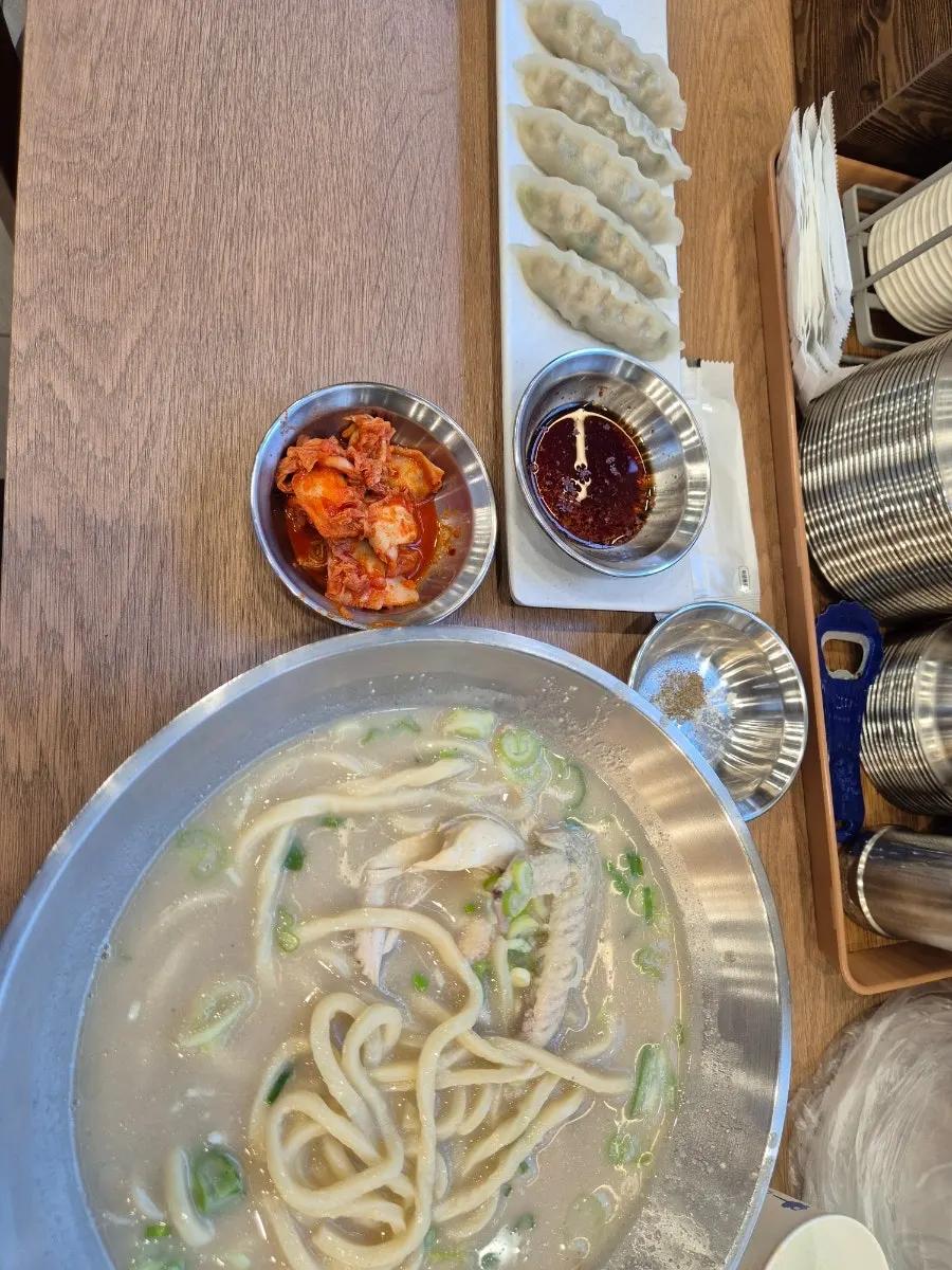 Dak kalguksu served with a whole chicken