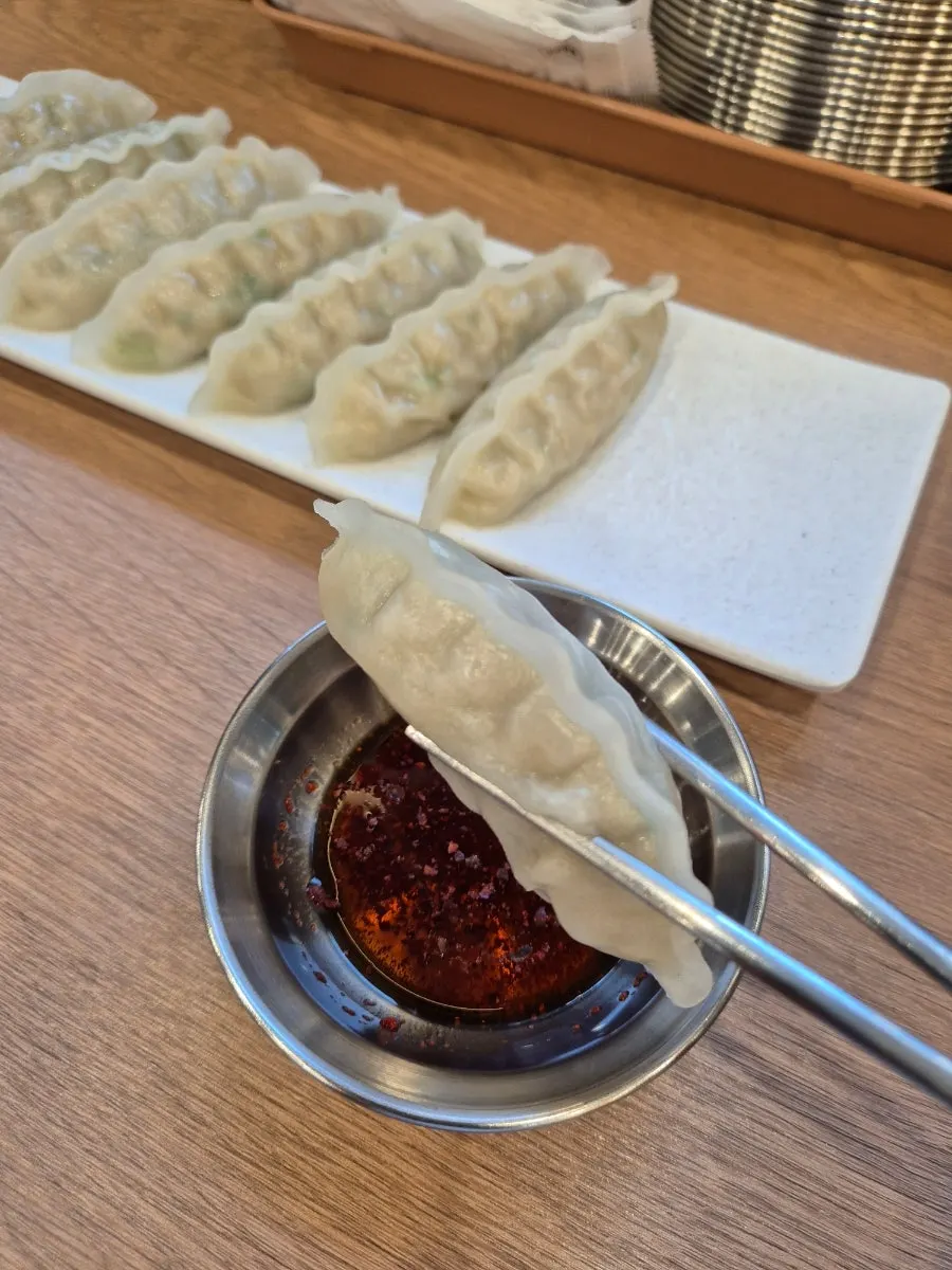 A plate of steamed dumplings, the side dish