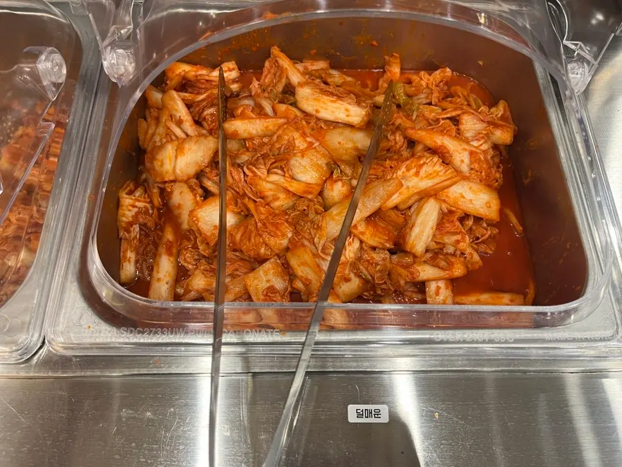 Kimchi and pickled radish set out at the self-serve bar