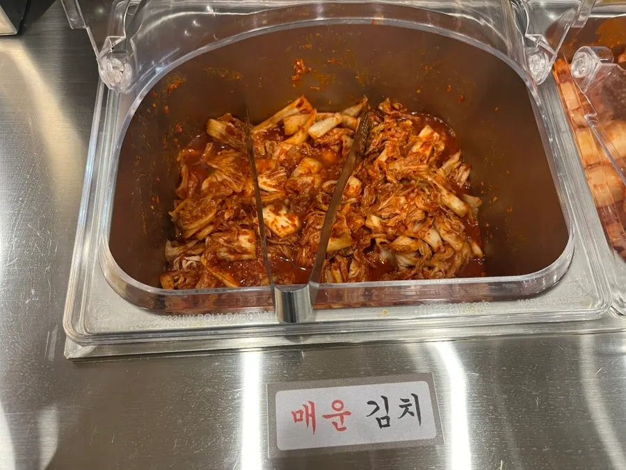 Self-serve bar with a sign about the kimchi
