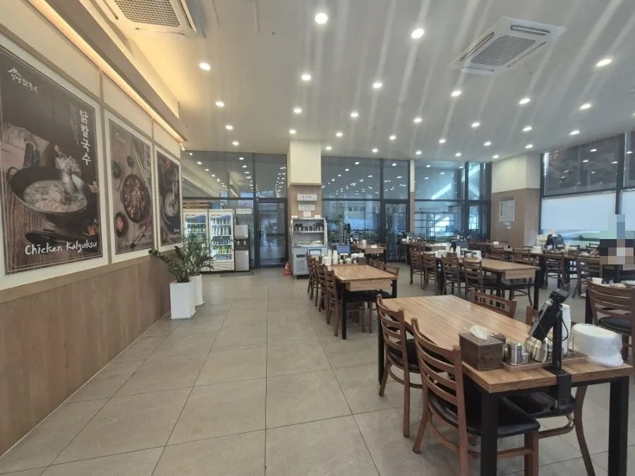 View of the dining hall lined with tables