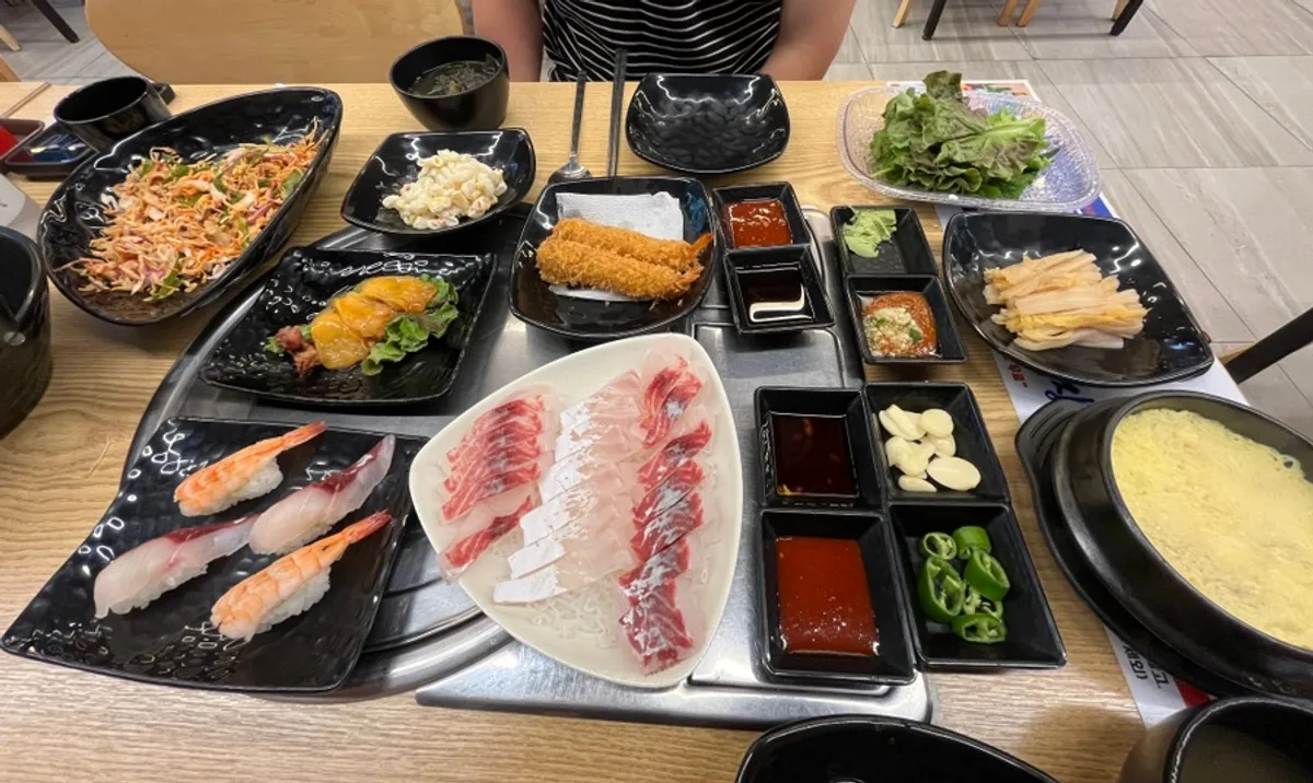 Table fully spread with the lunch set sashimi meal