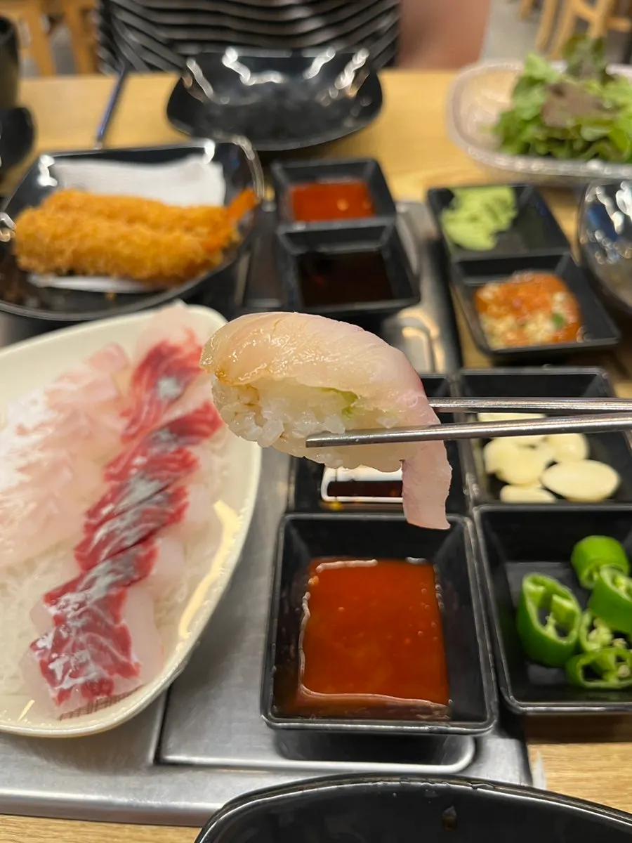 Plate of thickly sliced assorted sashimi
