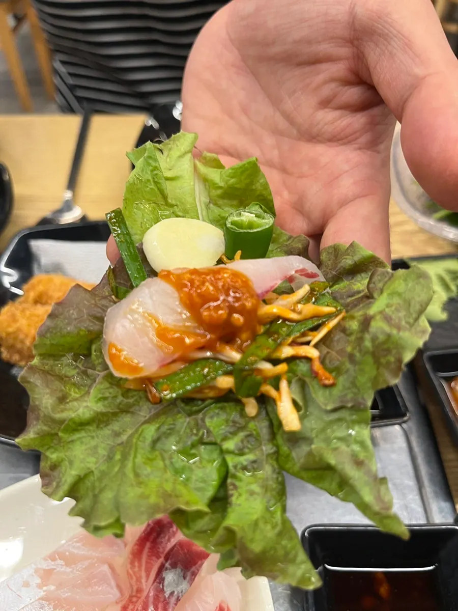 Sushi dipped in wasabi soy sauce
