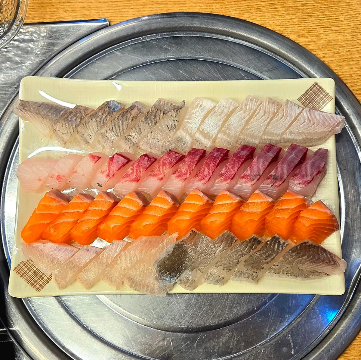 Small assorted platter of flounder, mullet, and salmon sashimi