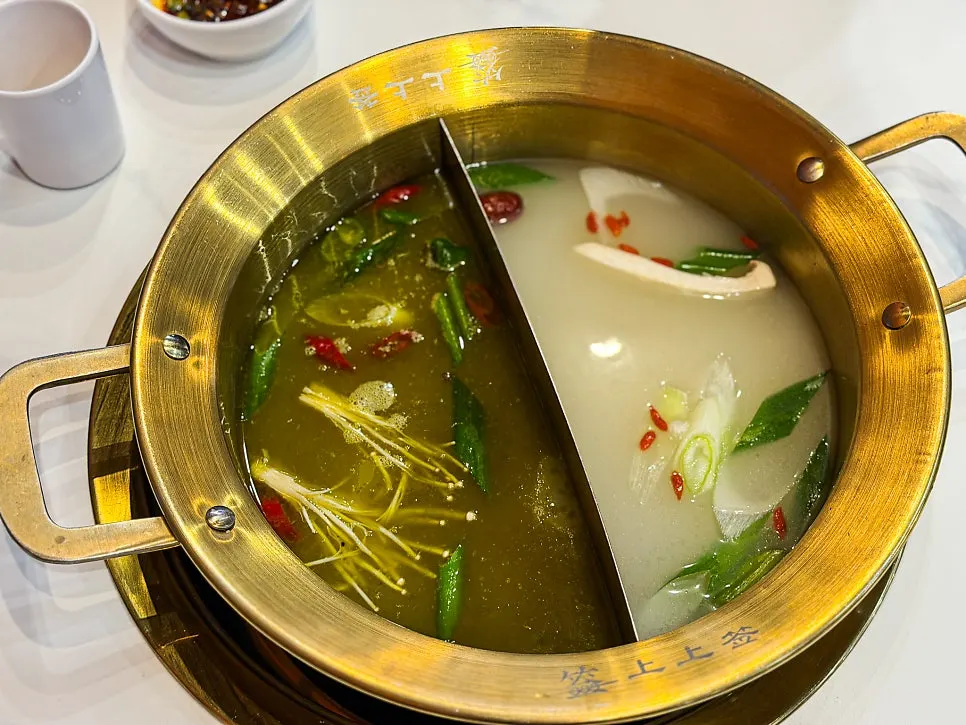 Photo in the context of choosing spicy red and mild white broths