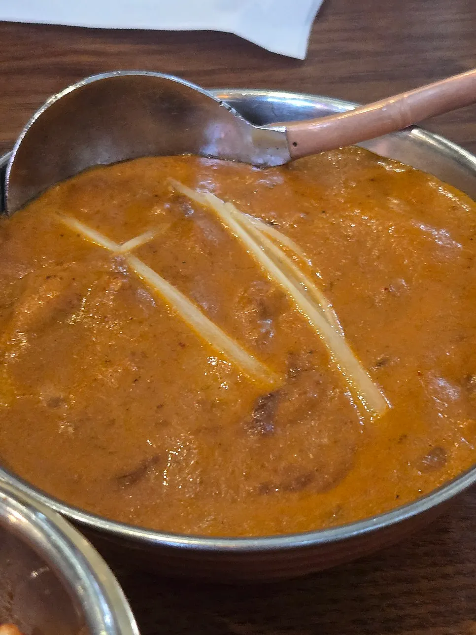 Salad topped with mango sauce