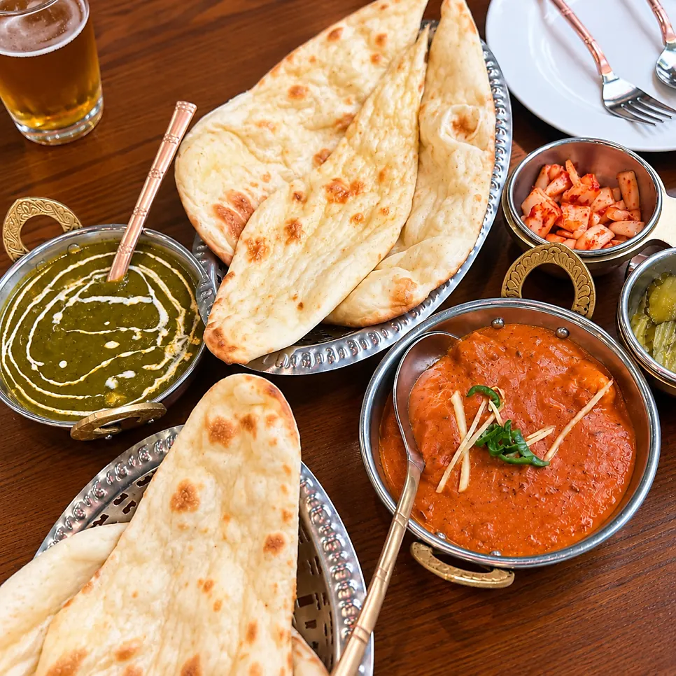 Spinach curry and chicken masala Indian dishes