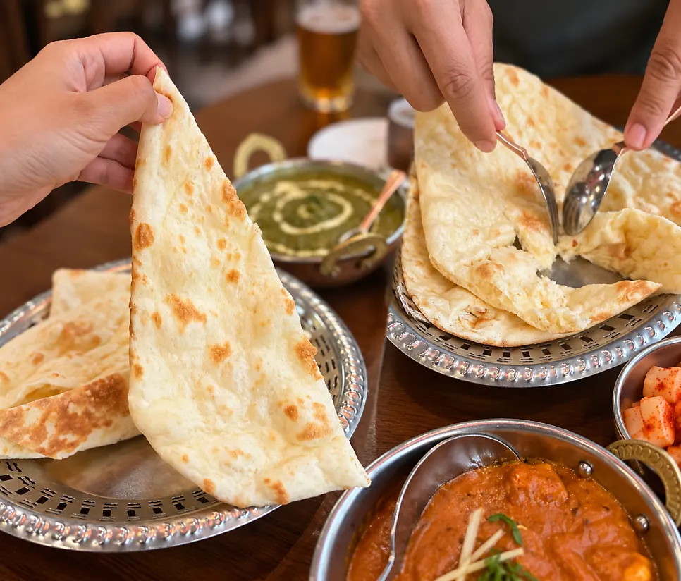 Warm butter-scented naan served with curry