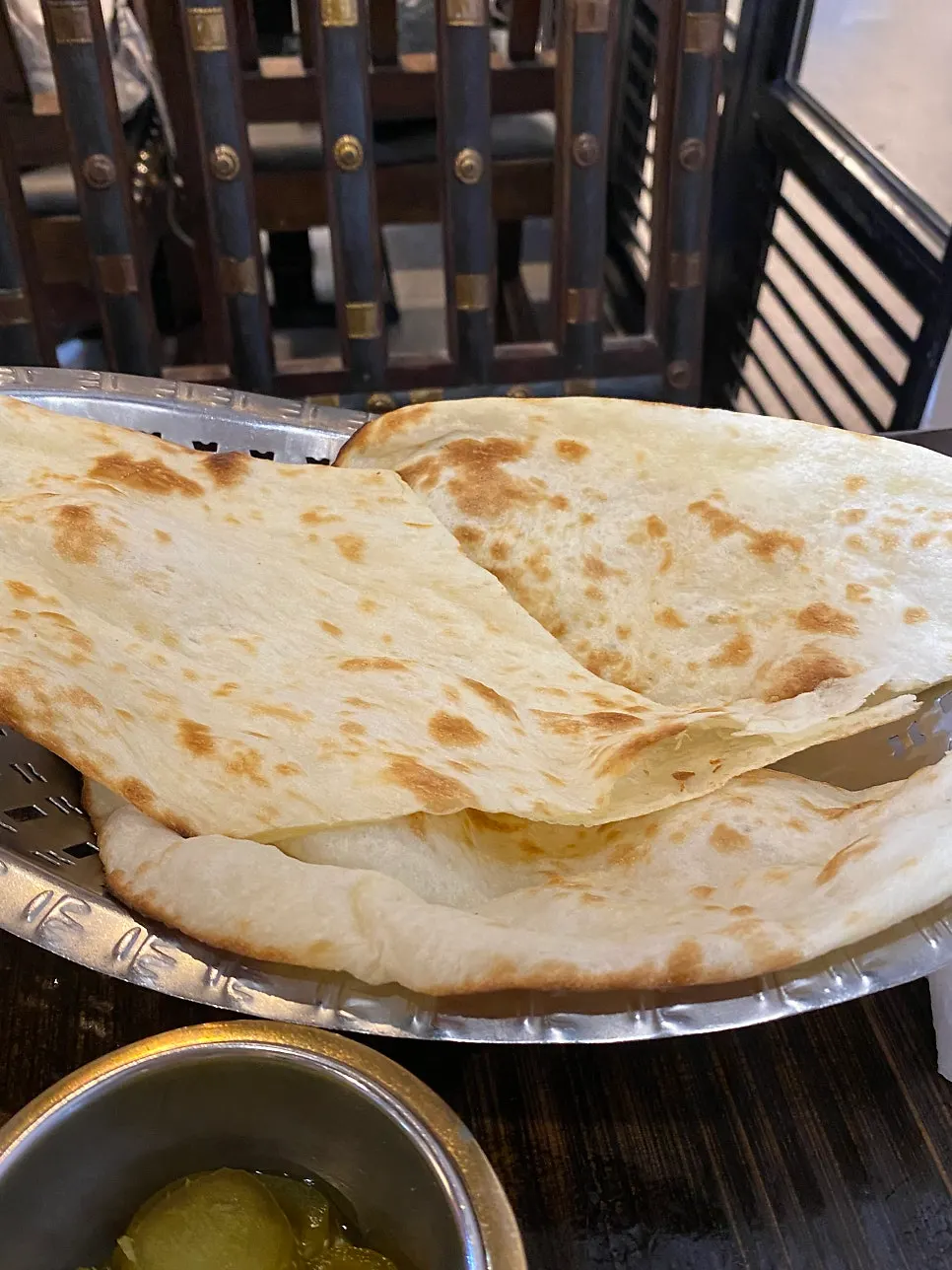 Freshly baked regular naan straight from the oven