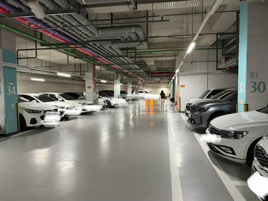 Underground parking-garage passageway toward Building C of the Central Park Prugio retail complex