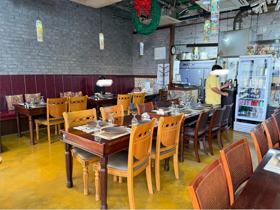 Restaurant interior with wooden tables and bench seating